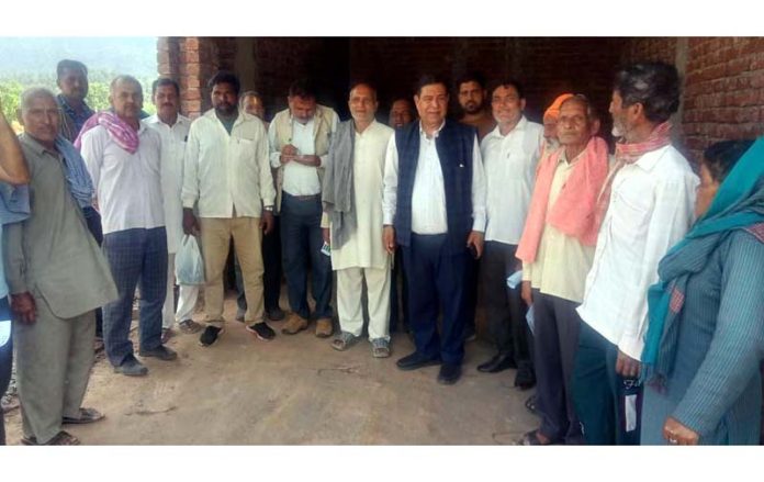 Former MLC and JKPCC senior vice president, Ravinder Sharma during meeting with farmers in Sunderbani area of Rajouri on Wednesday.