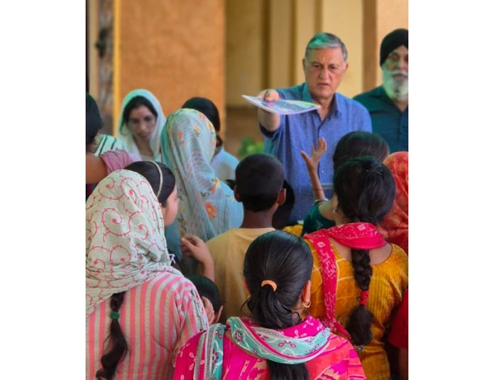 Hira Lal Abrol, Chairman of HISI distributing stationery items among poor students in Jammu on Monday.