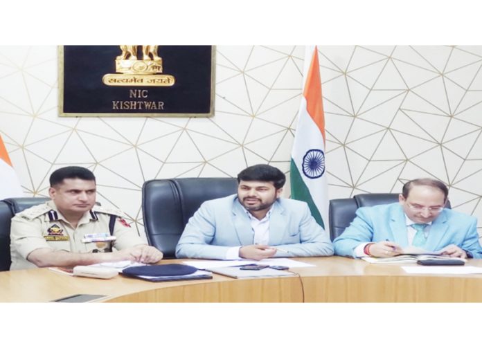 DC Kishtwar Dr. Devansh Yadav chairing a meeting.