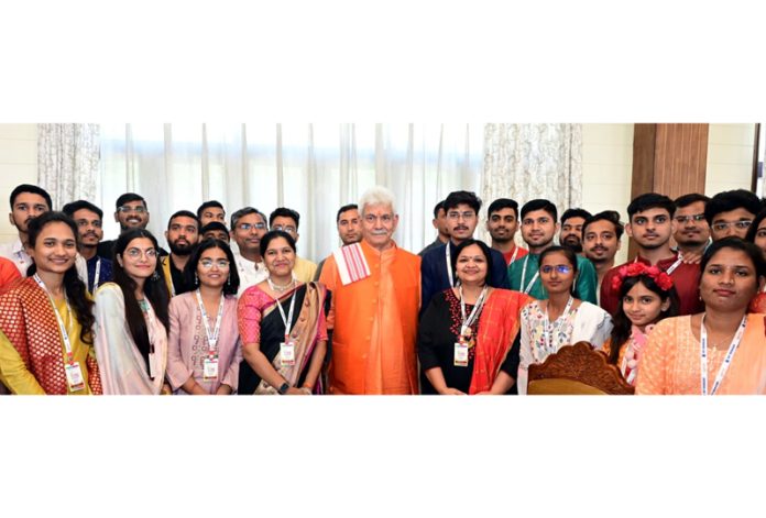 LG Manoj Sinha posing for a group photograph with youth delegation from Maharashtra on Tuesday. LG Manoj Sinha posing for a group photograph with youth delegation from Maharashtra on Tuesday.