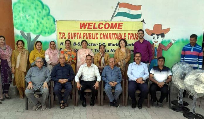 Members of TR Gupta Trust posing during a programme organised in Jammu on Sunday.