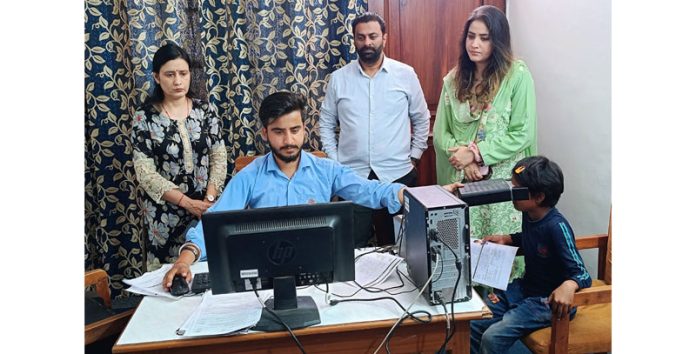 Samvedna Society officials and others during Aadhar Enrollment Camp in Jammu on Monday.