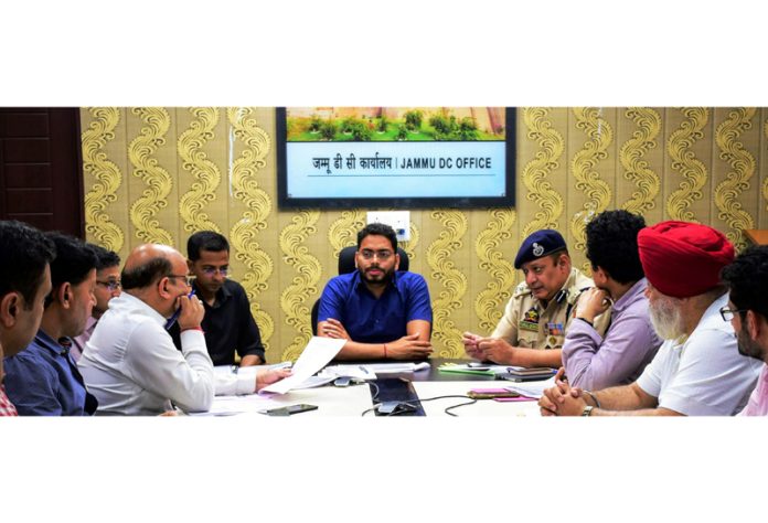 DC Sachin Kumar Viashya chairing a meeting on Tuesday.