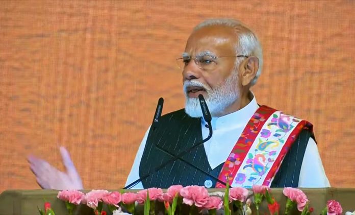 Prime Minister Narendra Modi addressing a function at SKICC Srinagar on Thursday.