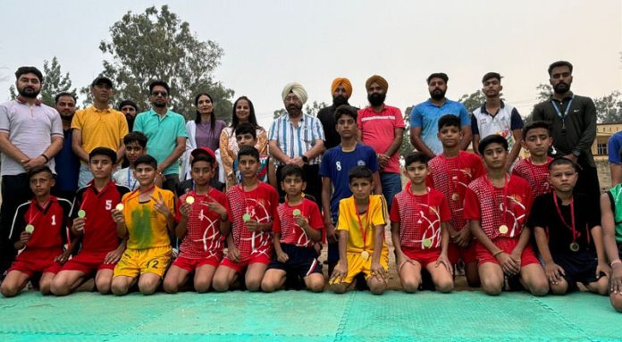 Kho Kho players posing along with dignitaries during a match.