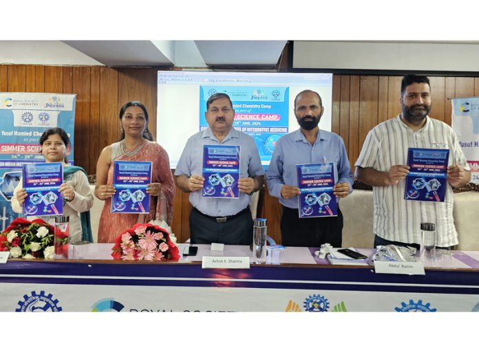 DSEJ and others releasing a booklet during inaugural of the Summer Science Camp at IIIM.