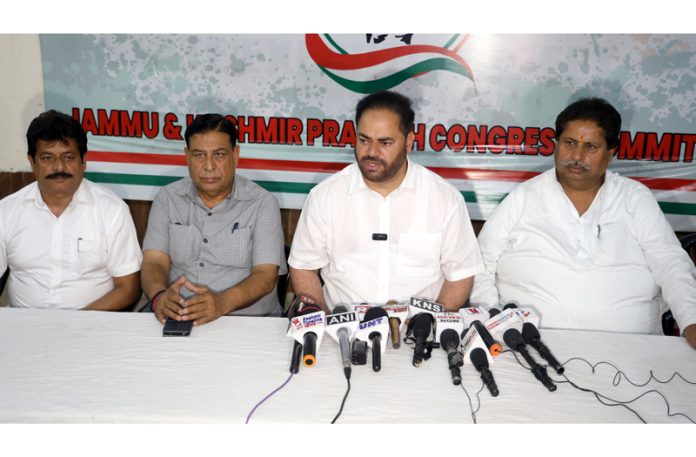 JKPCC chief Vikar Rasool Wani flanked by working president Raman Bhalla and senior vice president Ravinder Sharma at a press conference in Jammu. -Excelsior/Rakesh