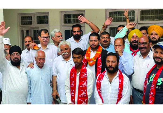 Senior NC leader Ajay Sadhotra with new entrants at Shiv Nagar in Jammu West Constituency on Monday. Senior NC leader Ajay Sadhotra with new entrants at Shiv Nagar in Jammu West Constituency on Monday.