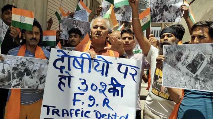 DF&SS workers raising slogans during a protest rally in Jammu on Saturday. DF&SS workers raising slogans during a protest rally in Jammu on Saturday.