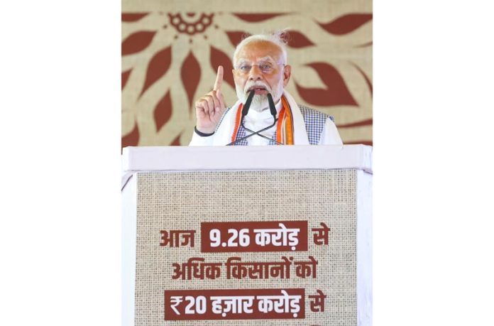 Prime Minister Narendra Modi addressing Kisan Samman Sammelan in Varanasi, Uttar Pradesh on Tuesday. (UNI)