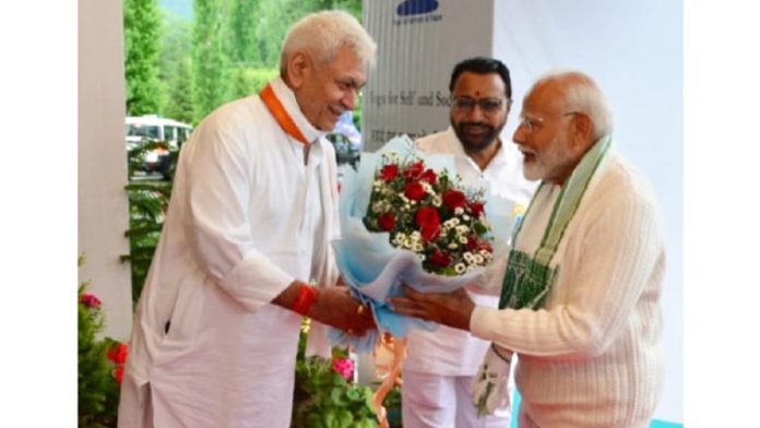 LG Manoj Sinha welcoming PM Narendra Modi at IYD event in Srinagar on Friday morning.