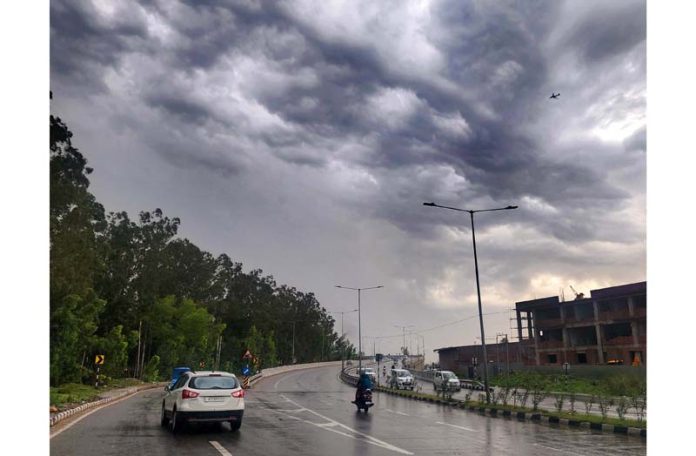 Dark clouds hover over Jammu city on Saturday morning. -Excelsior/Rakesh