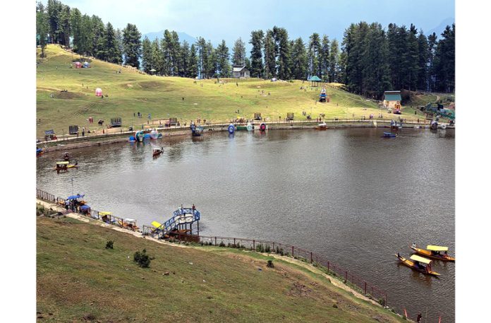 Tourists enjoying ‘Shikara Ride’ in a lake at picturesque Sanasar in Ramban district on Sunday.(UNI)