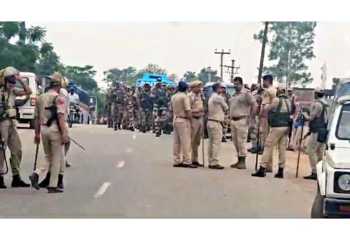 Police and CRPF personnel during an anti-encroachment drive in village Purab Chak, Kathua on Saturday. -Excelsior/ Pardeep