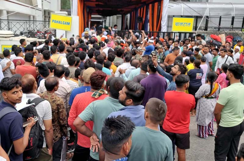 Shri Amarnath Ji Yatris waiting in long queues at Saraswati Dham near Railway Station for registration on Saturday.-Excelsior/Rakesh