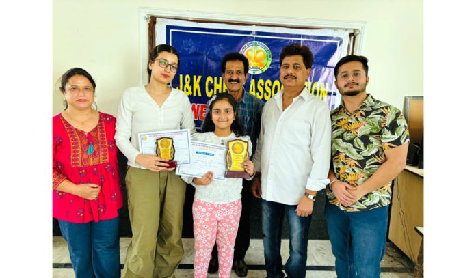 Winner of Chess Championship posing along with president AJKCA Baldev Raj and others.