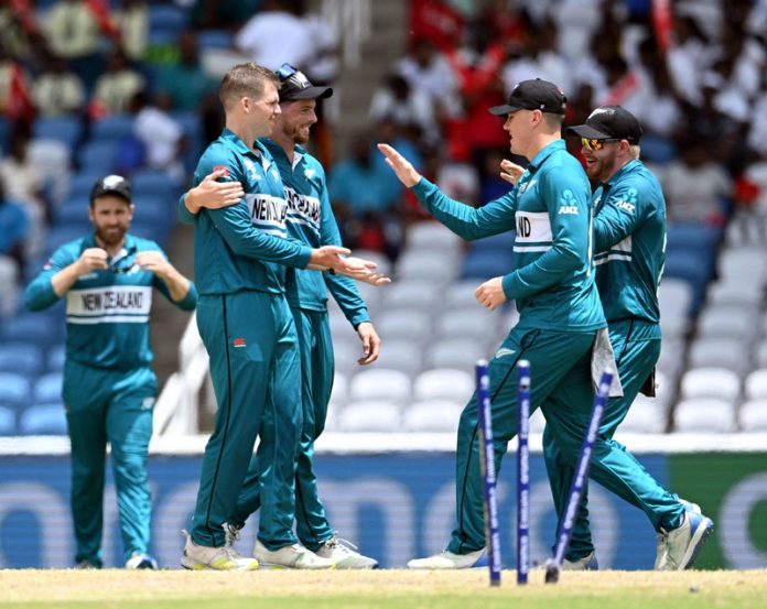 Lockie Ferguson celebrating after records spell against PNG.