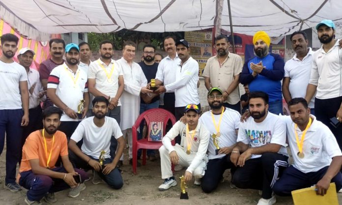 Players posing along with dignitaries during award ceremony at Udhampur on Monday.