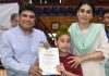 Secretary YSS, Sarmad Hafeez and Secretary JKSC, Nuzhat Gul presenting a certificate to youngster.