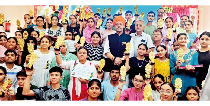 Senior BJP leader Devender Singh Rana posing along with meritorious students of Block Dansal.