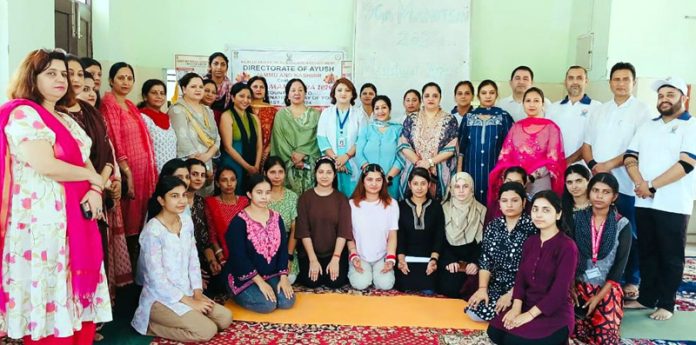 Students of Government College of Education and others during a yoga camp on Tuesday.