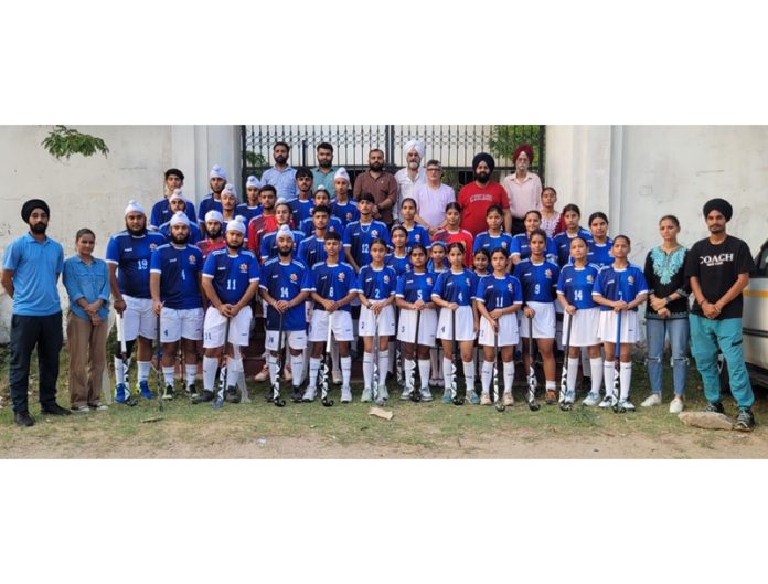 Junior Hockey teams of J&K posing for group photograph along with dignitaries at Jammu before leaving to participate in National Championship to be held at Jhansi, UP.