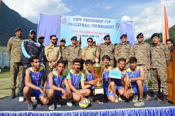 Winning team posing along with senior officials of Police and CRPF at Srinagar on Saturday.