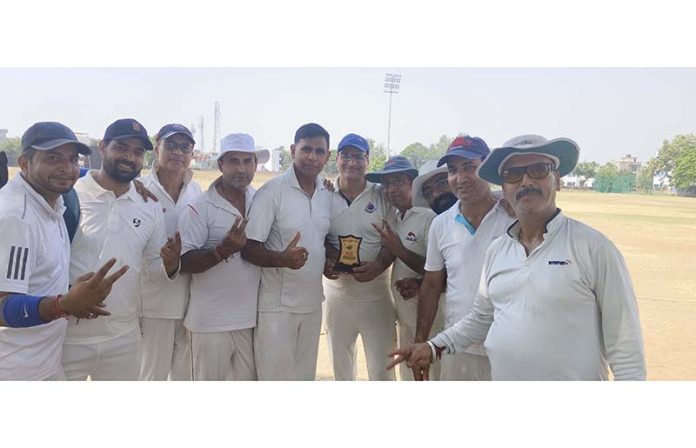 Winning team posing along with trophy. Winning team posing along with trophy.