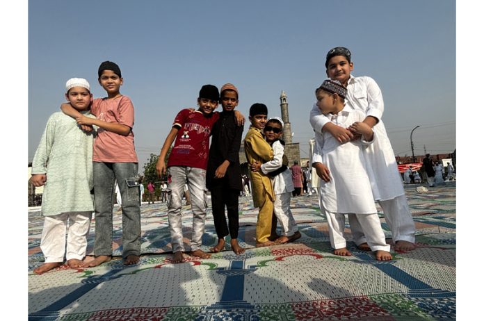 Children greeting and hugging each other to offer Eid Mubarak after Eid prayers at Jammu on Monday. — Excelsior/Rakesh Children greeting and hugging each other to offer Eid Mubarak after Eid prayers at Jammu on Monday. — Excelsior/Rakesh