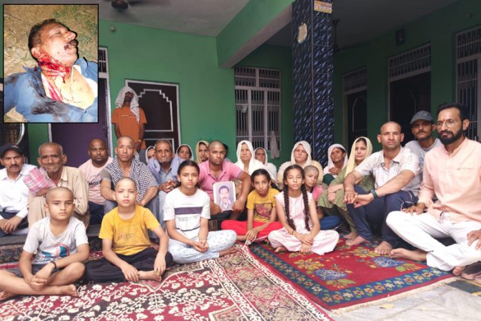 Children and villagers during protest against the murder of Dr Amarjeet Sharma at Hiranagar on Wednesday.