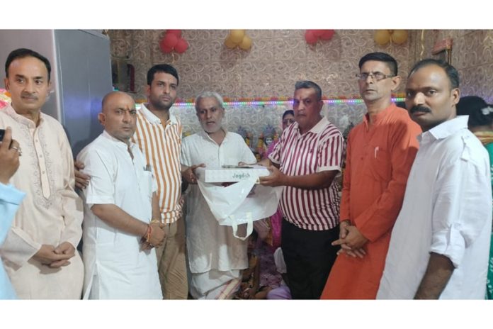 Devotees during celebration of foundation day of Raja Maldev temple at Kali Janni in Jammu on Monday.
