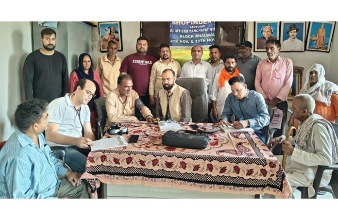 HoD Cardiology Dr Sushil Sharma examining patients at Gharota on Sunday.