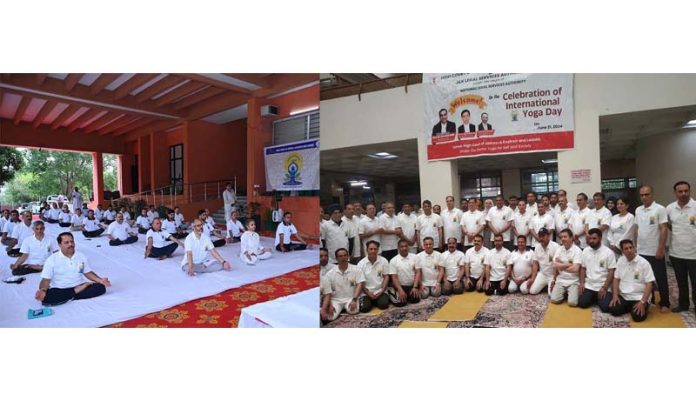 Staff of J&K High Court during Yoga Day event at High Court Complex Jammu (left) and Srinagar (right) on Friday. Staff of J&K High Court during Yoga Day event at High Court Complex Jammu (left) and Srinagar (right) on Friday.