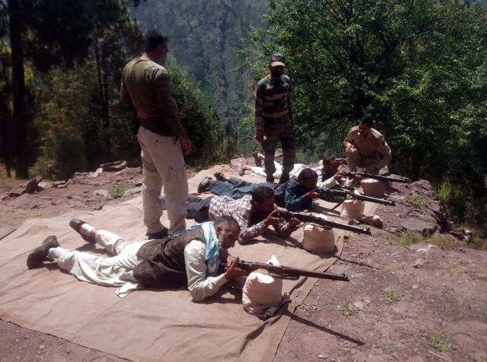 VDGs conducting fire practice under the supervision of Policemen.