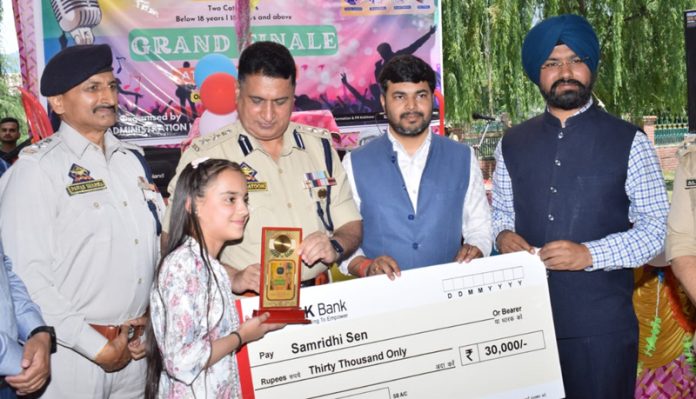 Civil and Police Administration officers awarding a winner during the finale of the Kishtwar Idol Season 2 on Monday. Civil and Police Administration officers awarding a winner during the finale of the Kishtwar Idol Season 2 on Monday.