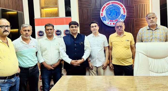 Rahul Sahai, Chair PHDCCI posing along with the members of Fruit Association in Jammu on Friday.