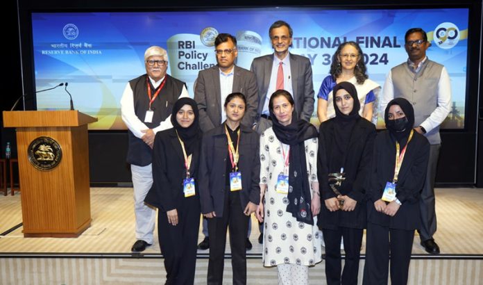 Students of KU along with others pose for a photograph after securing second place in national round of programme 'RBI Policy Challenge 2023'.