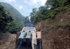 Passengers pusing a vehicle on slippery Thannamandi - DKG Road in Rajouri. -Excelsior/Imran