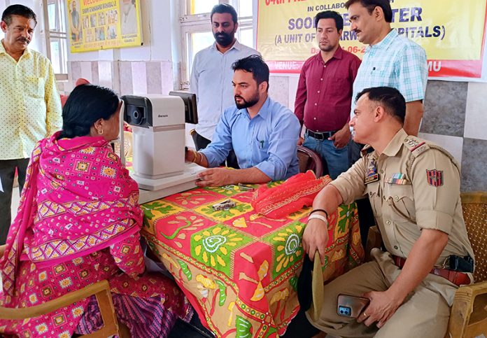 A doctor examining a patient during an eye check-up camp in Jammu on Friday.