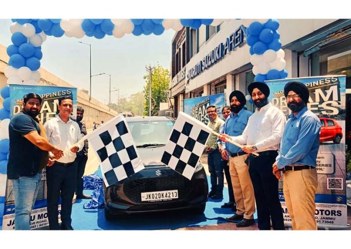 Sanjay Aggarwal, Managing Director of Jammu Motors launching Dream Series scheme in Jammu on Sunday.