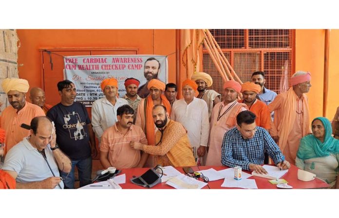 HoD Cardiology GMC Jammu Dr Sushil Sharma examining patients at Vijaypur on Sunday.