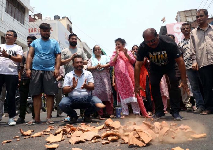 People staging protest against PDD and PHE Department in Jammu on Wednesday. -Excelsior/Rakesh People staging protest against PDD and PHE Department in Jammu on Wednesday. -Excelsior/Rakesh
