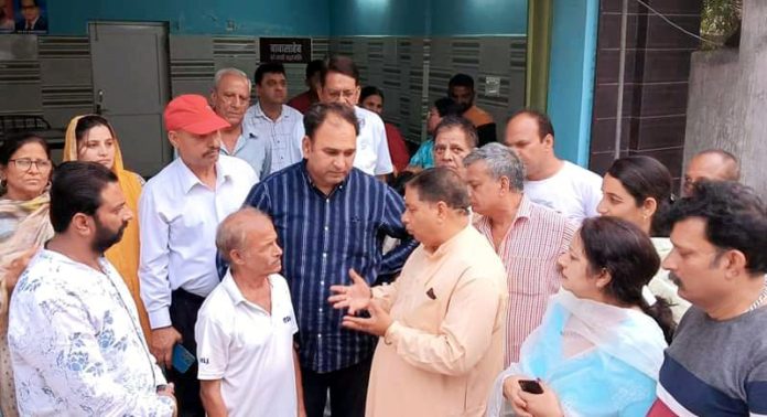 Former Minister and senior BJP leader, Sat Sharma listening public grievances at Jammu on Friday.
