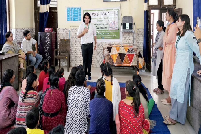 A demonstrator makes the gathering aware on POCSO Act at R.S Pura on Saturday.