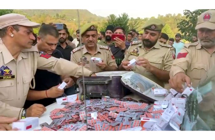 Rajouri police seizes huge quantity of banned drugs from two peddlers on Saturday. -Excelsior/Imran