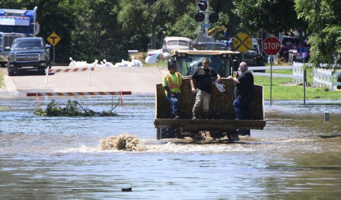Flooding forces people from homes in some parts of Iowa while much of US broils again in heat Flooding forces people from homes in some parts of Iowa while much of US broils again in heat