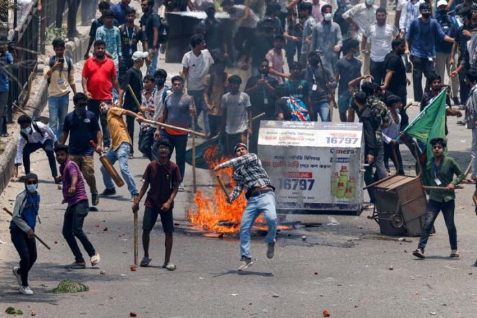 Anti-quota supporters clash with police and Awami League supporters at the Rampura area in Dhaka