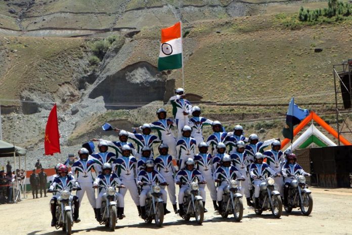 Troops performing motorbike stunts to honour the valour and sacrifices of the Kargil war heroes on the eve of 25th anniversary of Kargil war on Thursday. (UNI) Troops performing motorbike stunts to honour the valour and sacrifices of the Kargil war heroes on the eve of 25th anniversary of Kargil war on Thursday. (UNI)