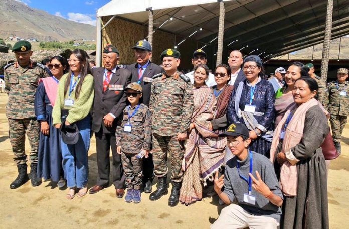 Army chief Gen Upendra Dwivedi posing with students, war veterans and others at Drass in Kargil on Thursday. Army chief Gen Upendra Dwivedi posing with students, war veterans and others at Drass in Kargil on Thursday.