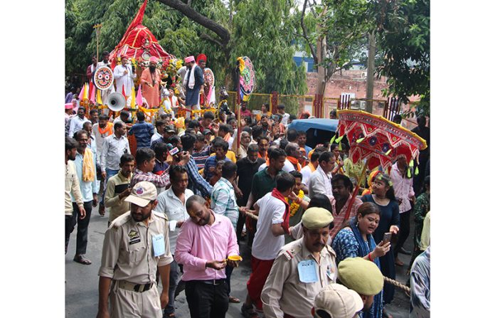 Devotees taking out Jagannath Rath Yatra in Jammu city on Sunday. -Excelsior/Rakesh
